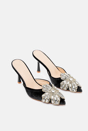 Melor – mules nero | TWENTYFOURHAITCH – vista tre quarti